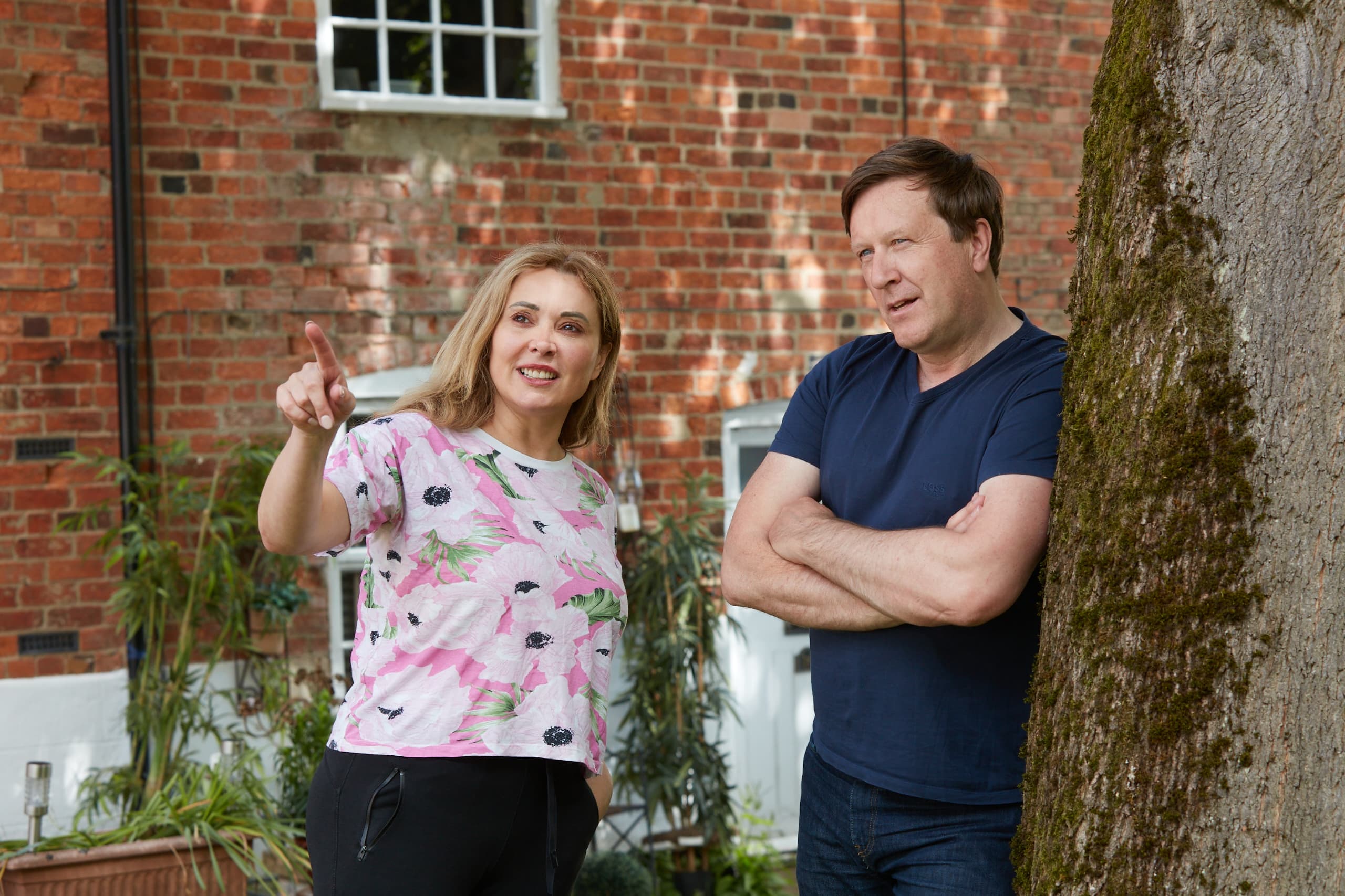 A couple at home in their garden